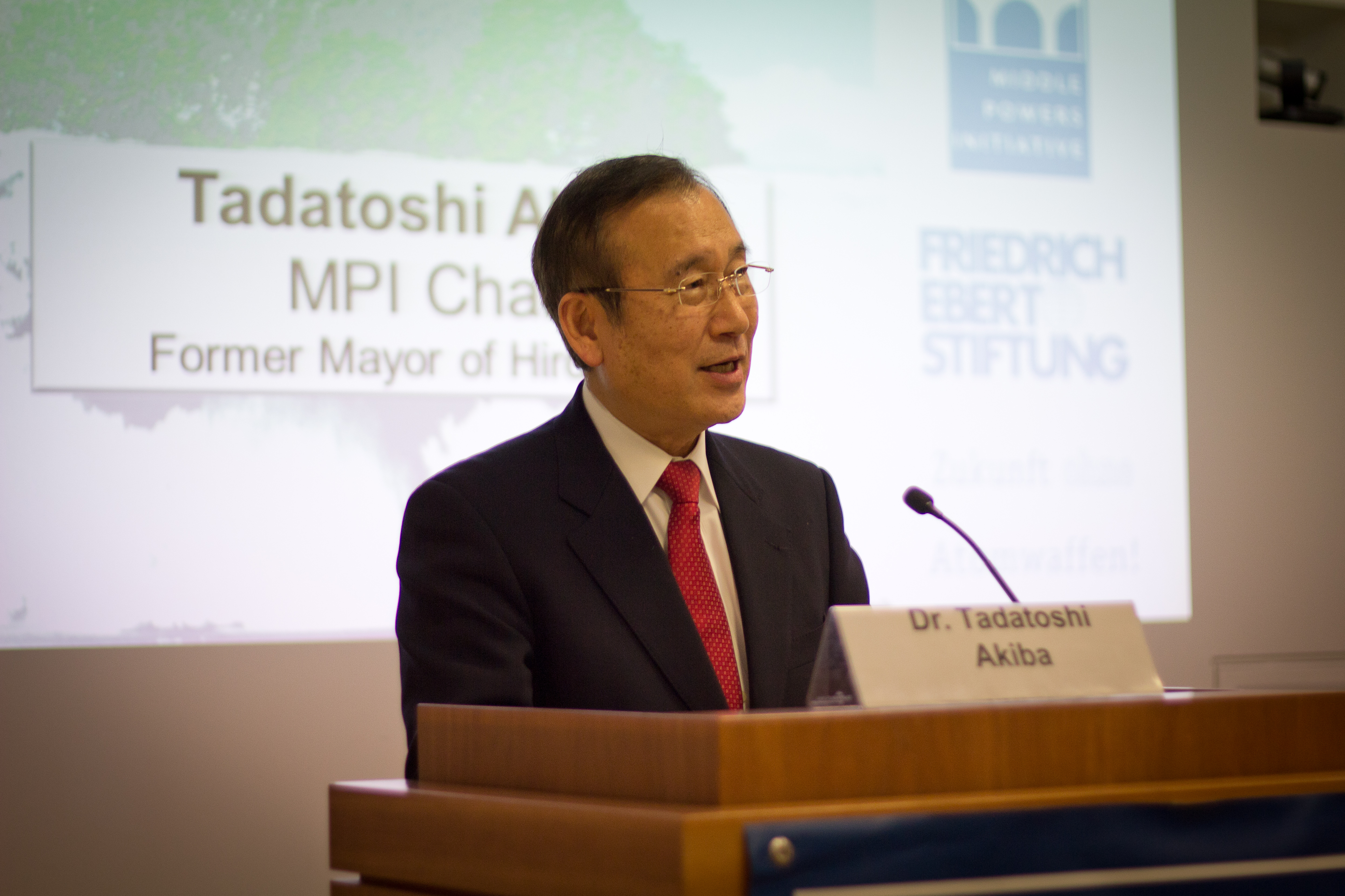 Tad Akiba, chair of the MPI, speaking at the public session